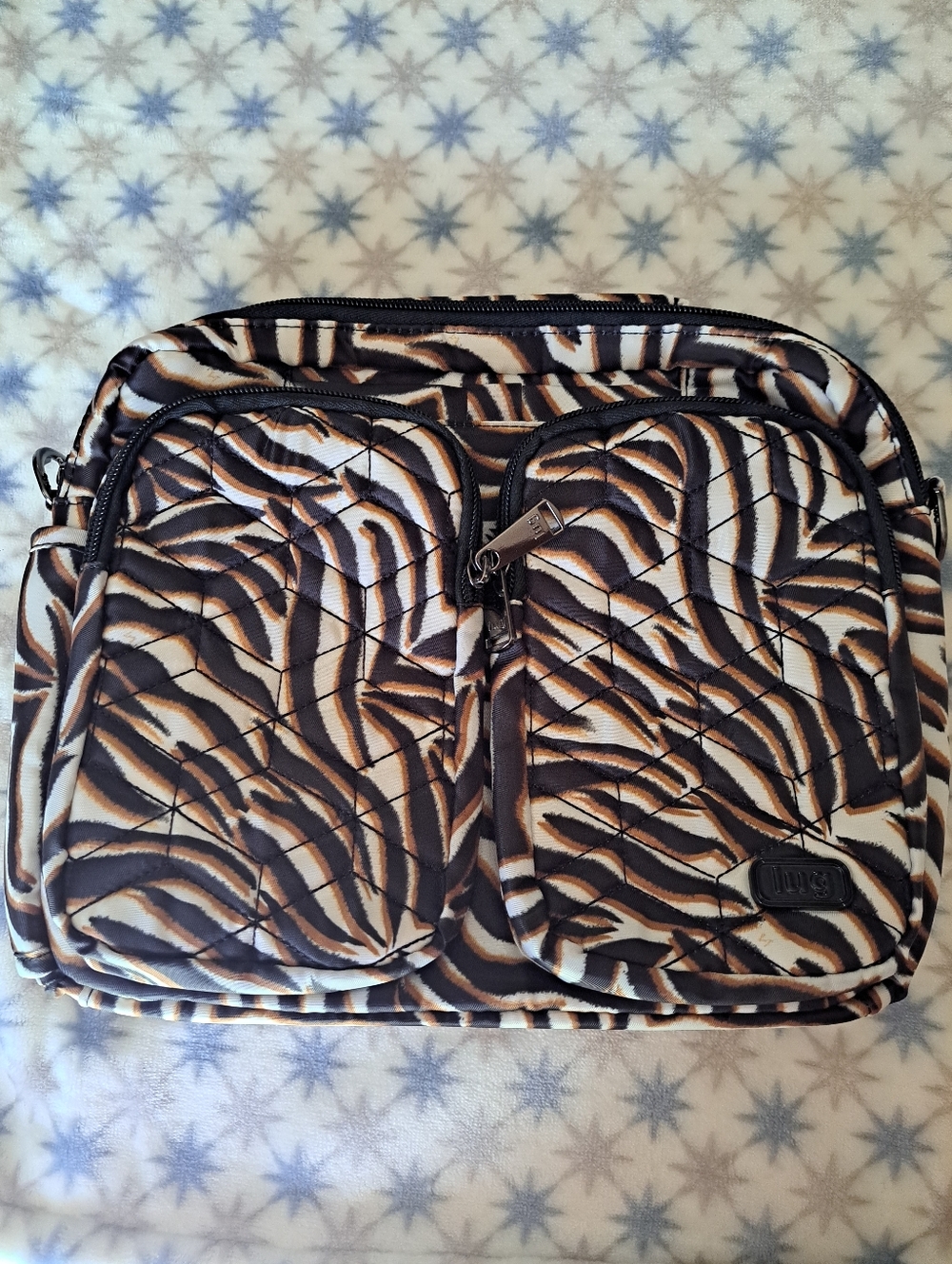 Lug Navigator Quilted Zebra-Print Crossbody Bag in Brown and Black